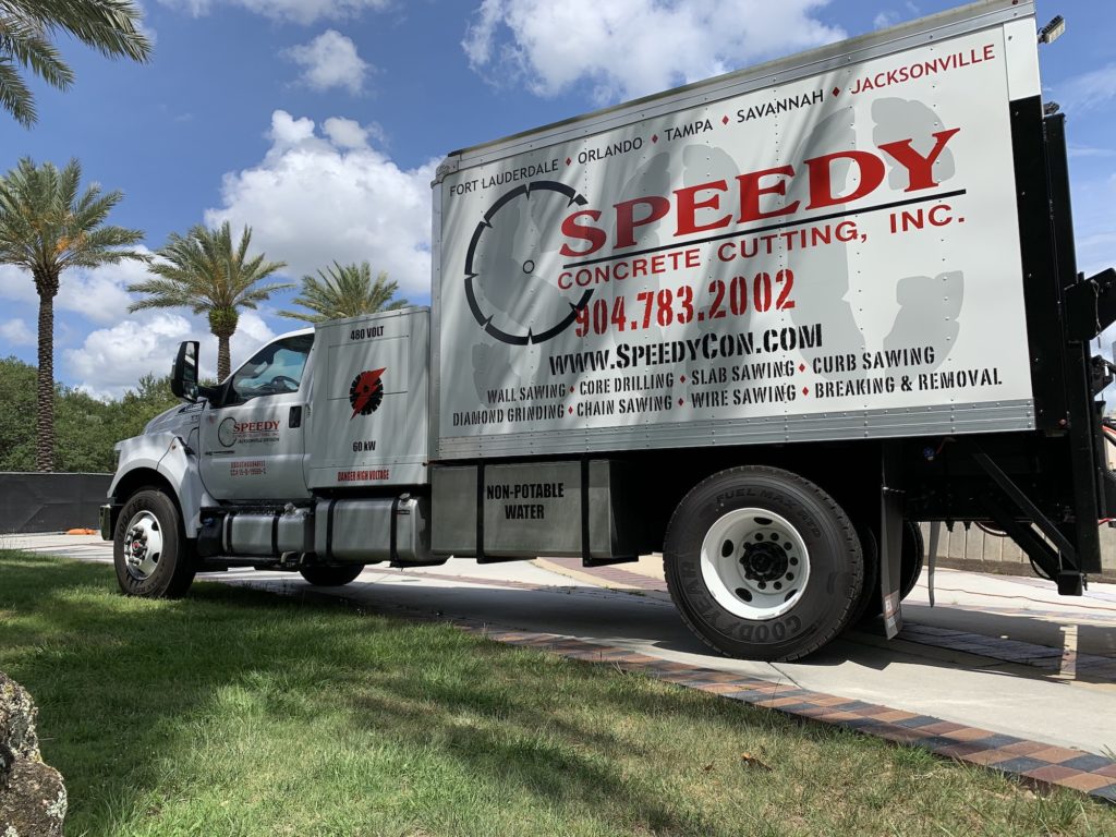 Speedy Concrete Cutting employee with company truck